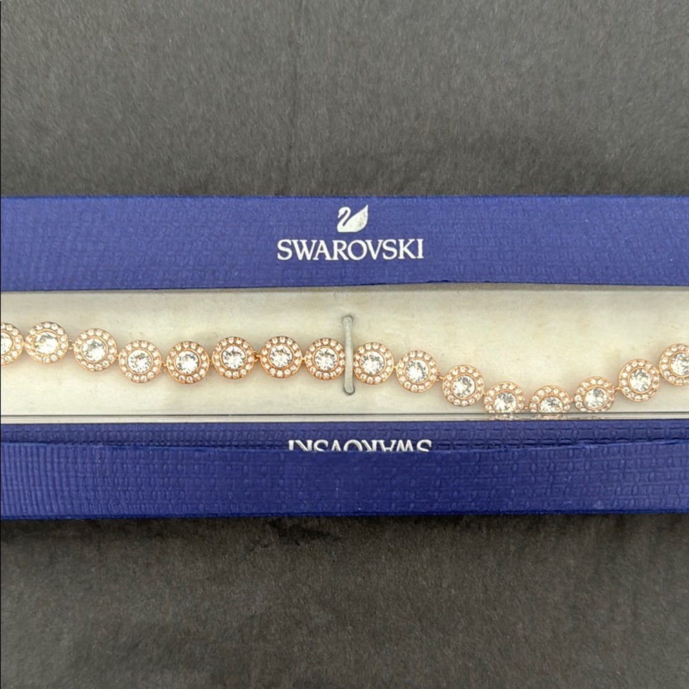 Swarovski crystal bracelet in rose metal, brand new in original box, never worn